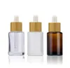 Flat Shoulder Glass Essential Oil Perfume Bottles Transparent Amber Frosted 30ml 1oz Eye Dropper Bottle with Bamboo Cap