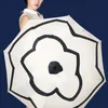Kvinnors paraplyer Camellia Designer Hög utseende nivå av enkel ljus lyxig vinyl UV Sunnig och regnig tillgänglig paraply