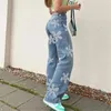 Los pantalones vaqueros de las mujeres ofrecen pantalones de mezclilla con estampado de flores de cintura alta pantalones de tubo recto elásticos con bolsillo