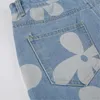 Los pantalones vaqueros de las mujeres ofrecen pantalones de mezclilla con estampado de flores de cintura alta pantalones de tubo recto elásticos con bolsillo