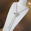 Chaînes Zi You Bijoux de mode pour femmes Micro Incrusté Zircon Accessoires Collier de perles d'eau douce Pendentif Gland Longue chaîne de pull