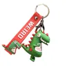 Mignon petit dinosaure poupée Action goutte colle porte-clés mâle et femelle personnalité créative sac pendentif cadeaux