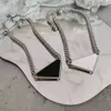 2021 womens mens Luxury designer Necklace chain fashion jewelry black and white triangle pendant design party silver hip hop punk 301K