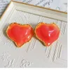 In "Peach's Premature" the ancient vintage is fashionable sweet large jelly honey peaches exaggerated and labeled with earrings