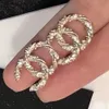 Glücksbringer Designer Gold Ohrringe Damen Ohrring Schleife Tropfen Party Hochzeit Kristall Strass Geburtstagsgeschenk Luxus Klassisch Marke Europäisch Amerikanisch