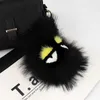 Porte-clés Longes Designer Luxe Fluffy Karl Véritable Fourrure De Raton Laveur Pompon Monstre Sac Bugs Charme Porte-clés En Peluche Porte-clés En Cuir Gland DI 958L