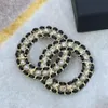 2021 nuovo stile cava lettere intrecciate in pelle nera spilla strass perla ottone materiale moda gioielli eleganti216p