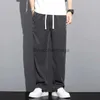 Męskie dżinsy 2023 NOWOŚĆ Soft Lyocell Fabric Męskie dżinsy jesienne cienkie luźne proste spodnie dżinsowe sznurka elastyczna talia Koreańska swobodna spodni 231003