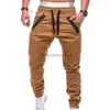 メンズジーンズの春と秋のファッションメンズドローストリング調整可能なポケットパンツ新しいカジュアルメンズパンツジョギングスリムフィットストライプ衣類l231003