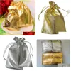 Titulaires de faveurs Sacs d'emballage en tissu doré / argenté Pochettes à bijoux Favorise le sac cadeau de fête de Noël 7x9cm / 9x12cm Événements de livraison directe Suppl Dhpdl