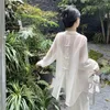 Blouses Femmes 2023 Chemise de crème solaire coréenne Femmes Vêtements d'été Mode Back Bow Élégant Lâche Manches longues Voir à travers des hauts blancs