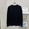 Chandails pour femmes de haute qualité début de l'automne étiquette en cuir ample poitrine lettre laine bouton tricots Cardigan haut col rond pull à manches longues 100% laine pull