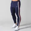 Pantalon de survêtement blanc Jogger hommes décontracté pantalon en coton maigre pantalon d'entraînement de Fitness mâle printemps vêtements de sport pantalons de survêtement bas P083201