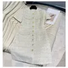 2023 Autumn Beige Tweed Single-Breasted Dress Short Sleeve Round Neck Double Pockets Elegant Casual Dresses 3A2733362159