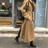 Mulheres misturas de lã inverno coreano mulheres faux casacos de lã moda elegante sólido cinto espessamento longo jaqueta feminina solta todo o jogo outwear 230928