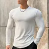 Wiosna jesień Koreańskie wszechstronne elastyczne paski Solidny okrągły szyjka T Shirt Mężczyźni śrubowe gwint sportowy trening Slim długi rękaw Top 231005