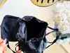 Designer de moda lona mochila mochilas de luxo sacos de viagem ombro mensageiro saco de luxo mochilas de alta qualidade com triângulo totes saco tamanho 30x29c P6IZ #