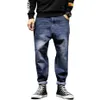 Mäns jeans herrar harem byxor mode fickor desering löst fit baggy moto män sträcka retro streetwear avslappnad avsmalnande 42287m