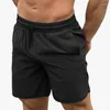 Pantaloncini da uomo Europeo Americano Uomo Palestre Fitness Bodybuilding Jogger Casual Corsa Pantaloni a cinque punti Pantaloni corti da spiaggia larghi slimfit
