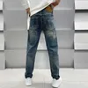 Projektant dżinsów męskich jesień i zima Guangzhou Xintang Botton Spring Spring Edition Slim Fit Black European European Blue Pants Ehk1