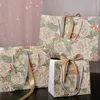 Confezione regalo 1 pezzo Borsa tote in carta stampata a fiori Modello con rose champagne Bomboniera Borse portatili con nastri Festa di fidanzamento nuziale