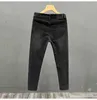 Jeans masculinos designer preto moedor de pedra lavado buraco de lágrima europeu outono / verão 2023 nova marca de moda elástica slim fit pequena manga reta HSVE