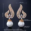 Charm Rakol Vintage CZ Crystal Imitation Pearls 심장 꽃 신부 웨딩 드롭 이어링을위한 로즈 골드 컬러 선물 보석 RE385 231006