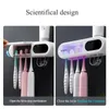 Titulares de escova de dentes UV Titular escova de dentes esterilizador creme dental espremedor dispensador de energia solar TypeC carga acessórios de banheiro conjunto 231005