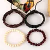 Pulseras con dijes 4 unids / set Vintage Boho Trenza Marrón Cuero Negro Beige Madera Rojo Onyx Piedra Cuentas Capas Pulsera Brazaletes Conjunto Unisex Mano