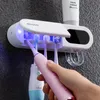 Titulares de escova de dentes UV Titular escova de dentes esterilizador creme dental espremedor dispensador de energia solar TypeC carga acessórios de banheiro conjunto 231005