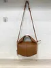 Pole French niche brand small size genuine leather women's bag with palm print hand held bag, single shoulder diagonal cross fitting dust bag 231007