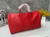 Fashion Red Water Ripple Leather Handbag Travel Påsar unisex 50 cm stor kapacitet axelpåsar lyxdesigner duffle påsar toppkvalitet crossbody rese bagage väska