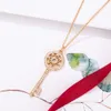 Collier Tiffanyes Designer De Luxe Mode FemmesV Or Tournesol Clé Collier Plaqué Or Rose 18 Carats Couronne Collier Simple Et Polyvalent Plein Diamant Chandail Chaîne