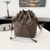 2023 NYA PU Material Bucket Bag High Sense Pull-Belt Small Påsar Stitching Mini Bag One-Shulder Crossboby Påsar