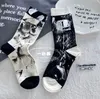 Automne et hiver nouveaux produits européens chaussettes femme personnalisé chaussette à la mode lettres Splash-Ink Style occidental célébrité Internet même Style Niche chaussettes pour femmes