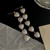 Boucles d'oreilles pendantes bijoux tendance Vintage Long coeur perle glands perles romantiques boucle d'oreille mode coréenne bijoux exagérés