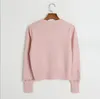 1004 2023 Runway Autumn Märke samma stil tröja långärmad kofta besättning hals rosa vita svarta gula modekläder hög kvalitet kvinnor dl