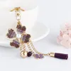 Porte-clés XDPQQ Europe et États-Unis Petite fleur Tassel Alliage Porte-clés Pendentif Couple Mode Anniversaire Cadeau de fête