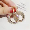 Nouveau design créatif boucles d'oreilles pendantes bijoux de haute qualité élégant cristal rond couleur or et argent fête de mariage pour les femmes E001287e