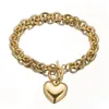 Hela eller detaljhandels charmiga 316L rostfritt stål silverfärgguld Rolo Oval Link Chain med Solid Heart Mens Womens Armband245y