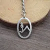 Keychains Simple Fashion Oval Snow Mountain Pine Tree Keychain Nature Jewelry Christmas Gift