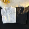 Chemises décontractées pour hommes Printemps Été Chemise à manches longues Coréen Streetwear Tendance Chemisier à revers High Sense Élégant Bouton Blanc Veste