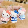 Porte-clés de poupée KT de dessin animé créatif, pendentif chat rose, colle goutte à goutte, sac de couple féminin, petit cadeau personnalisé, vente en gros