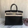 Borse originali Platino Borsa classica semplice e versatile Grana di litchi Togo Pelle di mucca Borsa da donna con fibbia portatile Borsa da sposa in pelle Borsa da sposa