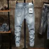 Rippade jeans män mager ljus blå hög gata stil manliga jeans elasticitet smal passform frayed casual män byxor byxor biker jeans t245l