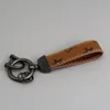 Designer Luis Keychain in pelle Ceyring Keyring Hitch Key Holdom Womens Chiama in lega di zinco Lettera di metallo bianco in metallo nero accessori piccoli accessori