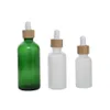 Botellas de embalaje Venta al por mayor Botellas cuentagotas de aceite esencial de vidrio ámbar mate de madera de bambú natural 15 ml 30 ml Envases cosméticos Oficina S Dhkmi