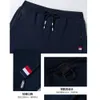 Męskie spodnie jesienne spodnie męskie fitness Sportswear dres elastyczne talia dresowe bawełniane spodnie luźne siłowni jogger track