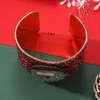 Bracciale rosso di Natale in ferro Gioielli 6,8 cm Decorazioni per cinturino in plastica Giocattolo di Babbo Natale Design dei cartoni animati Buon Natale Capodanno Regalo festivo Forniture per feste Ornamento