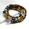 Charm Armband Natural 7 Chakra Tiger Eye Mala Armband 108 Buddha Healing Yoga Armband för kvinnor och man smycken Dropship 231009